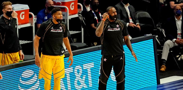 Giannis Antetokounmpo of the Milwaukee Bucks (left) watches on with LeBron James (right) in last year's edition of the NBA All Star Game.