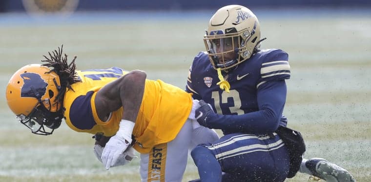 Kent State receiver Dante Cephas is takes down by Akron's Oran Singleton after a second quarter catch