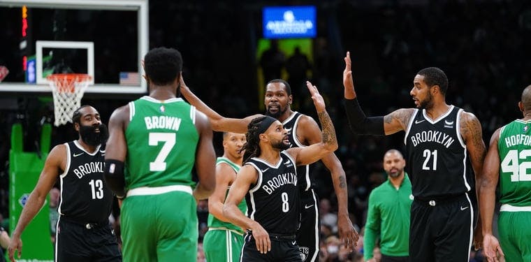 The Brooklyn Nets react after a play against the Boston Celtics in a November 2021 NBA matchup.