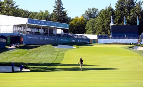 Workers prepare the 18th hole at the Wilmington Country Club for the BMW Championship