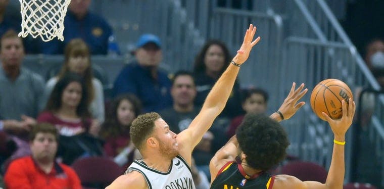 Jarrett Allen looks to shoot over Blake Griffin of the Nets in a November 2022 NBA contest.