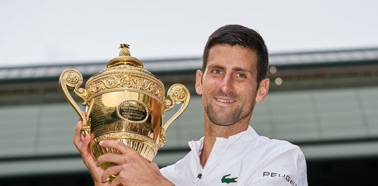 Novak Djokovic holds the Wimbledon trophy after beating Matteo Berrettini