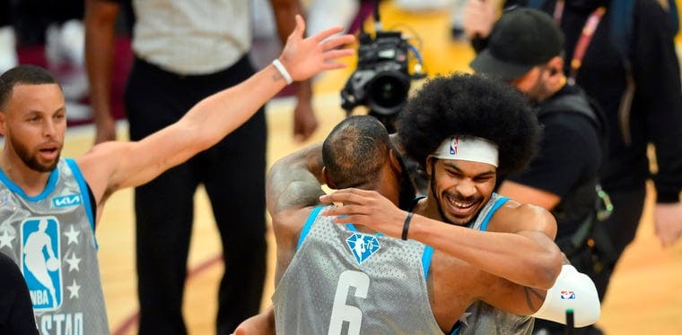 LeBron James hugs it out with Cavs center Jarrett Allen after a Team LeBron win in the All Star Game Sunday in Cleveland.