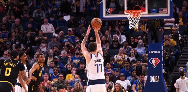 Mavericks guard Luka Doncic (77) shoots a free throw during the fourth quarter against the Golden State Warriors  during an NBA game at the Chase Center.