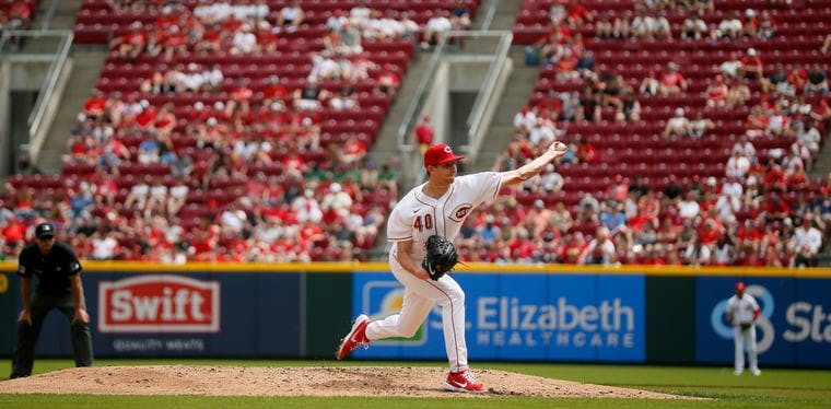 Reds starting pitcher Nick Lodolo throws a pitch in the third inning 
