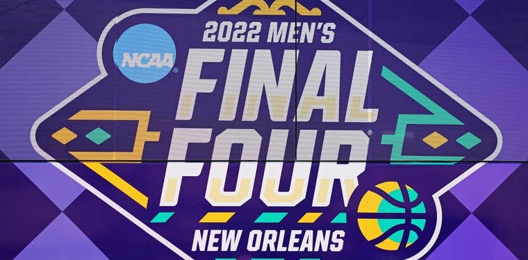 A detail view of the NCAA branded bus wrap as the team arrives before the 2022 NCAA men's basketball tournament Final Four semifinals at Caesars Superdome.
