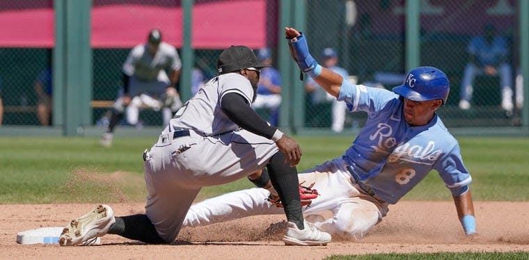 White Sox infielder Josh Harrison makes a late tag against Royals shortstop Nicky Lopez