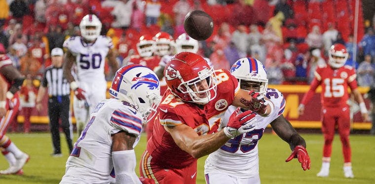 Buffalo Bills free safety Jordan Poyer (21) breaks up a pass intended for Kansas City Chiefs tight end Travis Kelce (87) during the second half at GEHA Field at Arrowhead Stadium.