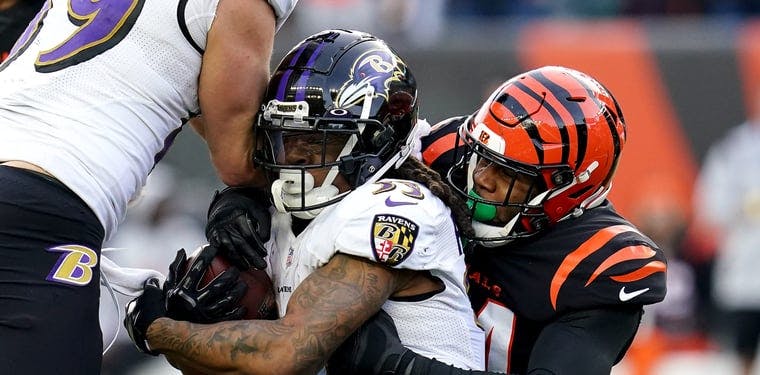 Bengals safety Vonn Bell tackles Ravens running back Davonta Freeman