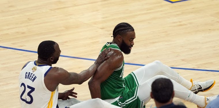 Celtics guard Jaylen Brown and Warriors forward Draymond Green collide during Game 2 of the 2022 NBA Finals