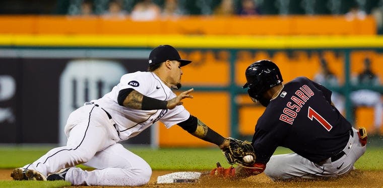 Tigers shortstop Javier Baez tags Cleveland Guardians shortstop Amed Rosario 