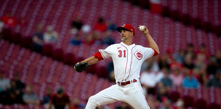 Reds starting pitcher Mike Minor delivers a pitch in the first inning