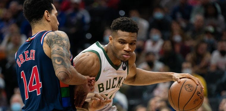 Bucks forward Giannis Antetokounmpo (34) looks to get by Sixers Guard Danny Green (14) in a November 2021 matchup between the two teams in Philadelphia.
