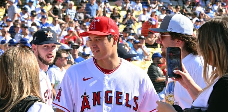 Angels pitcher Shohei Ohtani talks to media on the field before the 2022 Home Run Derby
