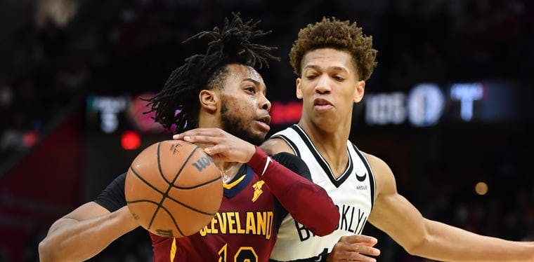 Cleveland Cavaliers guard Darius Garland (10) drives to the basket against Brooklyn Nets forward Kessler Edwards (14) in a 2022 NBA game at Rocket Mortgage FieldHouse.