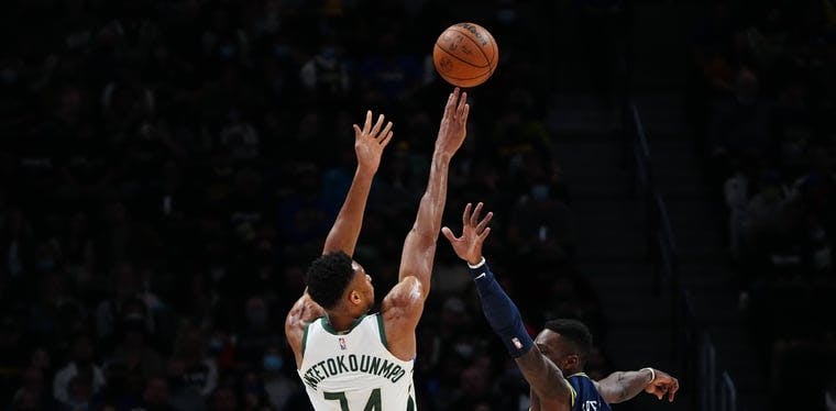 Giannis Antetokounmpo hoists a jumper of the Nuggets Jeff Green in a November 2021 contest between the Bucks and Nuggets.
