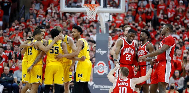 The Buckeyes and Wolverines huddle in the second of a game at Value City Arena at the Jerome Schottenstein Center.