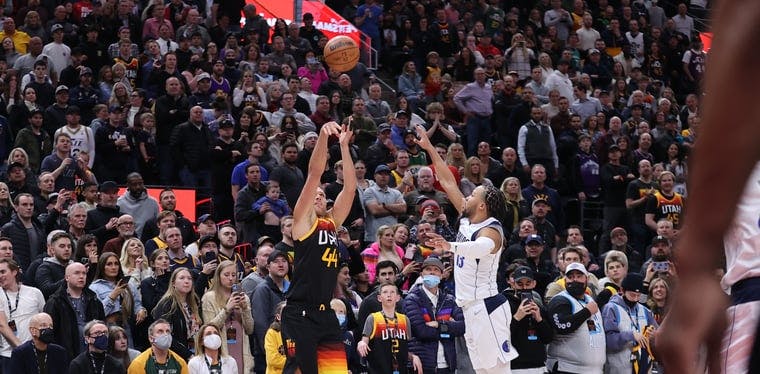Bojan Bogdanovich makes a three point basket against the Dallas Mavericks in an NBA game on February 25.