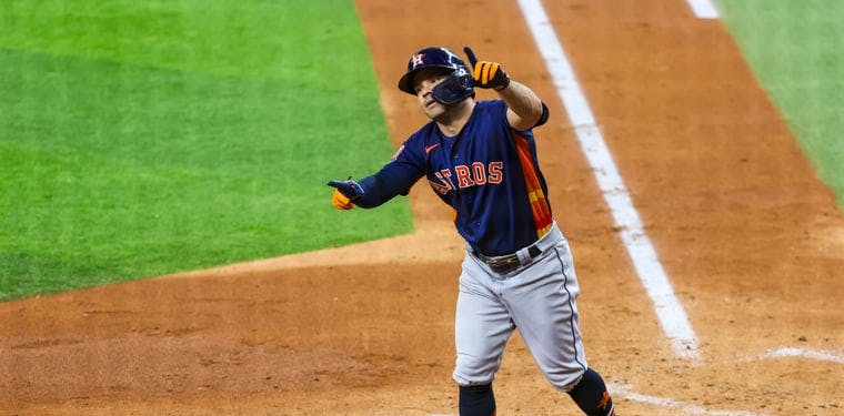 Astros second baseman Jose Altuve celebrates after hitting a home run against the Rangers