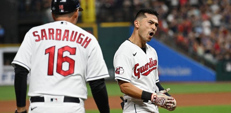 Guardians outfielder Steven Kwan celebrates an RBI triple vs. Chicago White Sox