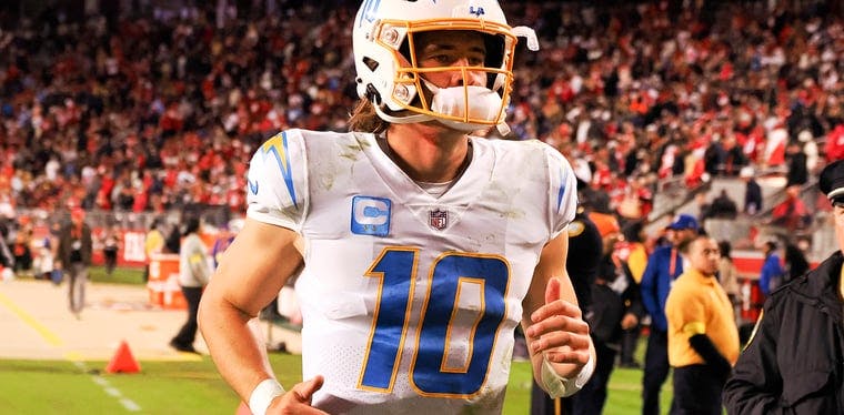 Los Angeles Chargers quarterback Justin Herbert jogs off field after game against the 49ers