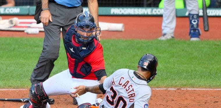 Guardians catcher Luke Maile tags out Tigers third baseman Harold Castro