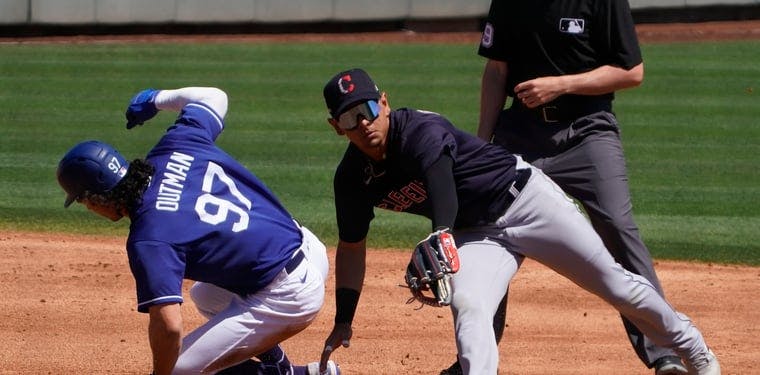 Cleveland shortstop Andres Gimenez can not make the tag on Dodgers James Outman