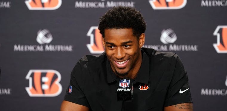 New Bengals safety Daxton Hill smiles during an introductory press conference