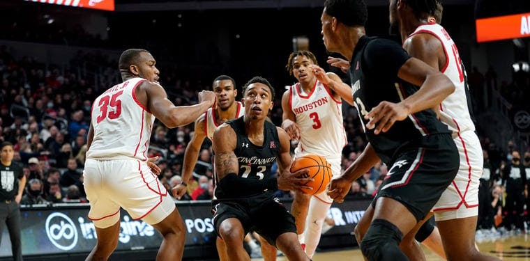  Bearcats guard Mika Adams-Woods (23) drives to the basket in the second half of an NCAA men's college basketball game against the Houston Cougars.
