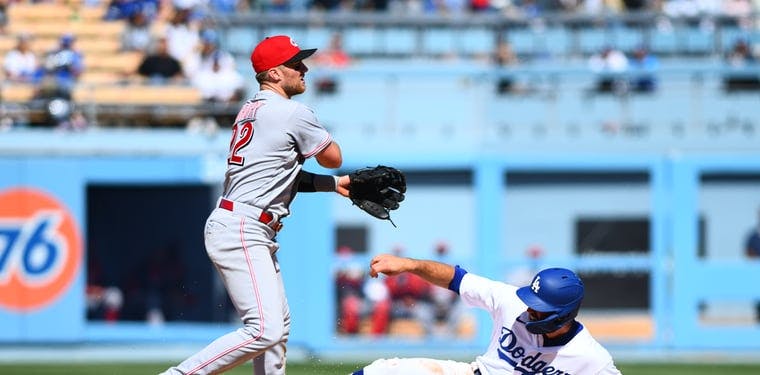 Reds third baseman Brandon Drury outs Los Angeles Dodgers left fielder Chris Taylor