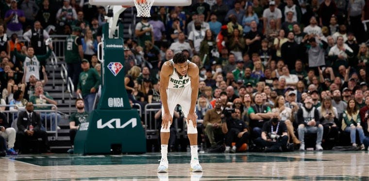 Bucks forward Giannis Antetokounmpo rests between plays during the fourth quarter against the Boston Celtics