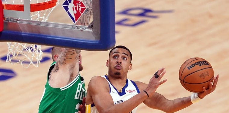 Warriors guard Jordan Poole shoots against Boston Celtics center Daniel Theis