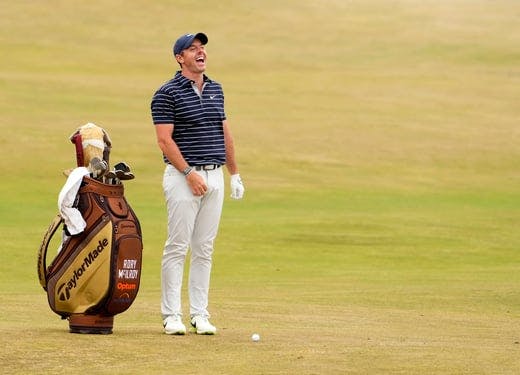 Rory McIlroy laughs on the 17th hole at the Open Championship golf tournament at St. Andrews Old Course