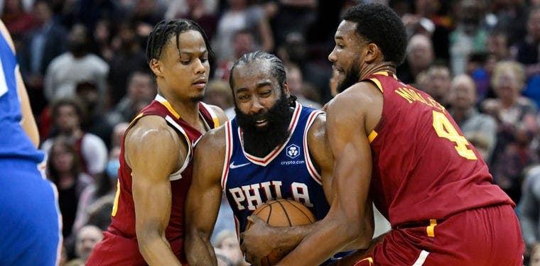  Cleveland Cavaliers forward Isaac Okoro (35) and center Evan Mobley (4) reach for the ball against Philadelphia 76ers guard James Harden (1) in the fourth quarter at Rocket Mortgage FieldHouse.