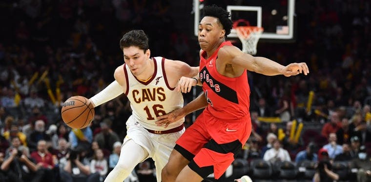 Cleveland Cavaliers forward Cedi Osman (16) tries to drive the basket against Toronto Raptors forward Scottie Barnes (4). Cavaliers and Raptors meet for a crucial matchup in Toronto tonight.