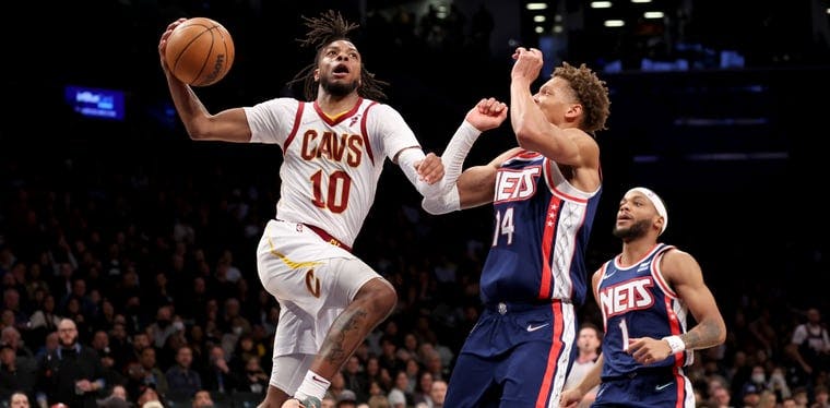 Cleveland Cavaliers guard Darius Garland (10) drives to the basket for an acrobatic layup against the Brooklyn Nets in the first half of Friday night's game from the Barclays Center.
