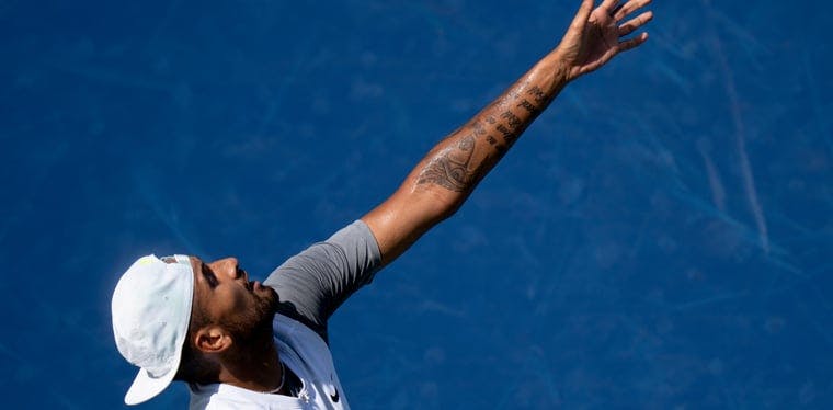 Nick Kyrgios serves to Taylor Fritz during their match in the Western & Southern Open