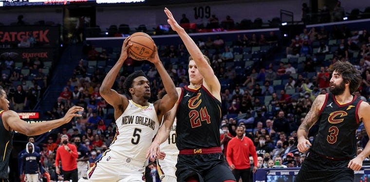 The Pelicans Herbert Jones (5) drives and looks to score against the Cavaliers Lauri Markkanen (24) in an earlier contest during the 2021-22 NBA season.