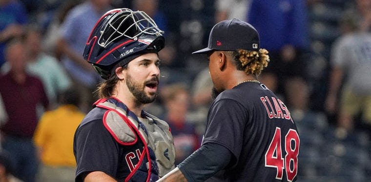 Cleveland Indians catcher Austin Hedges (17) celebrates with relief pitcher Emmanuel Clase (48) after the win over the Kansas City Royals at Kauffman Stadium.