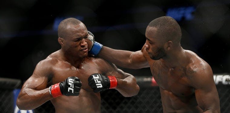 Leon Edwards moves in with a punch against Kamaru Usman during UFC Fight Night