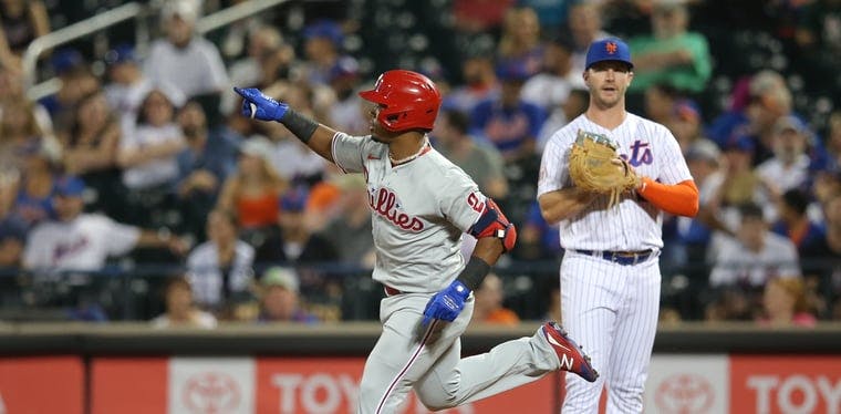 Philadelphia Phillies second baseman Jean Segura (2) points as he rounds the bases after he hit a solo home run against the New York Mets at Citi Field. Those two teams meet for first time in 2022 tonight.