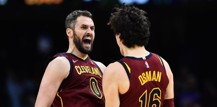 Cedi Osman (16) and Kevin Love (0) celebrate an Osman three point basketball as the Cavs went on a 19-0 run to start the fourth quarter at Rocket Mortgage Fieldhouse on Sunday Night.