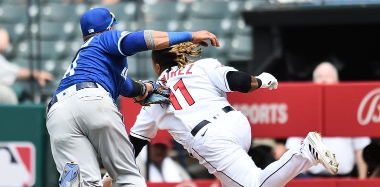 Royals first baseman Carlos Santana tags out Guardians runner Jose Ramirez during the fifth inning at Progressive Field