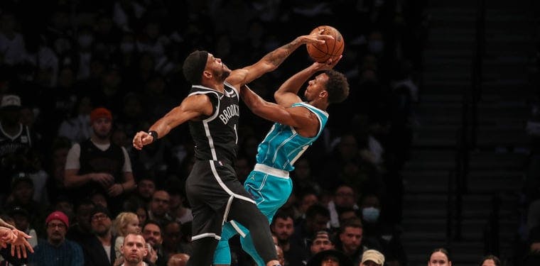 Brooklyn Nets guard Bruce Brown (1) blocks a shot taken by Charlotte Hornets guard Ish Smith (10) late in the game at Barclays Center