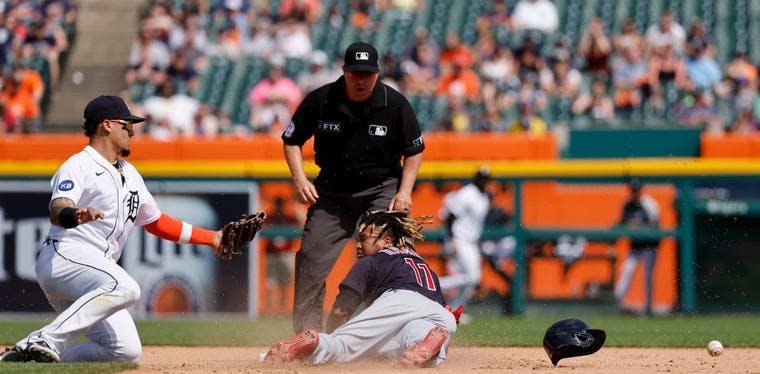 Guardians third baseman Jose Ramirez steals second on the throw to Tigers shortstop Javier Baez