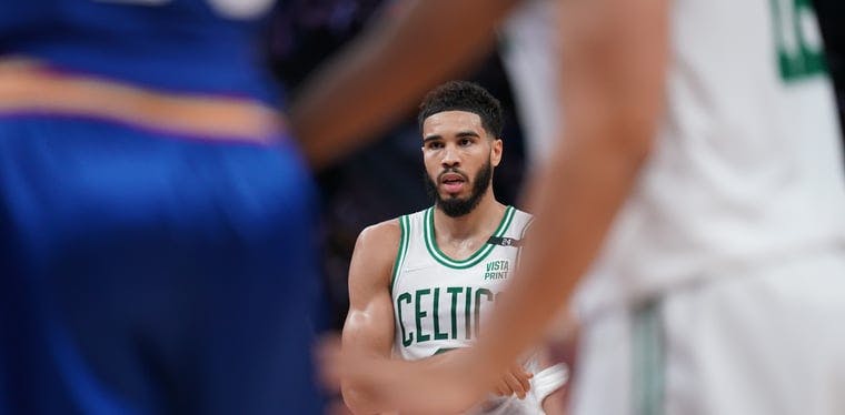 Celtics forward Jayson Tatum stands on the foul line before shooting a free throw against the Golden State Warriors