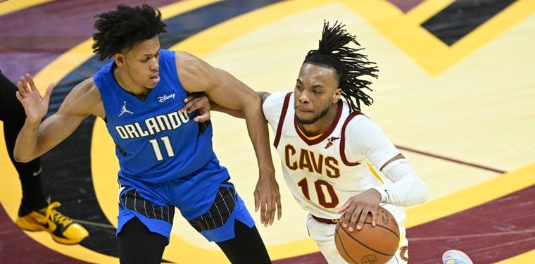 Orlando Magic guard Jeff Dowtin (11) defends Cleveland Cavaliers guard Darius Garland (10) in the fourth quarter at Rocket Mortgage FieldHouse