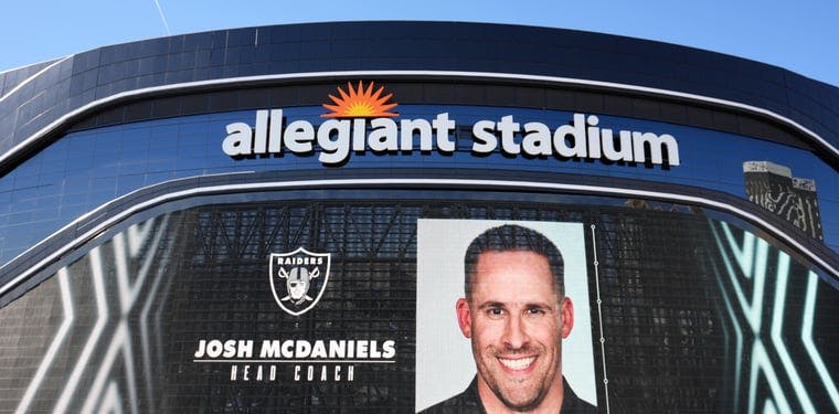 Josh McDaniels photo is displayed outside of the Las Vegas Raiders' Allegiant Stadium ahead of the Pro Bowl late last week. 