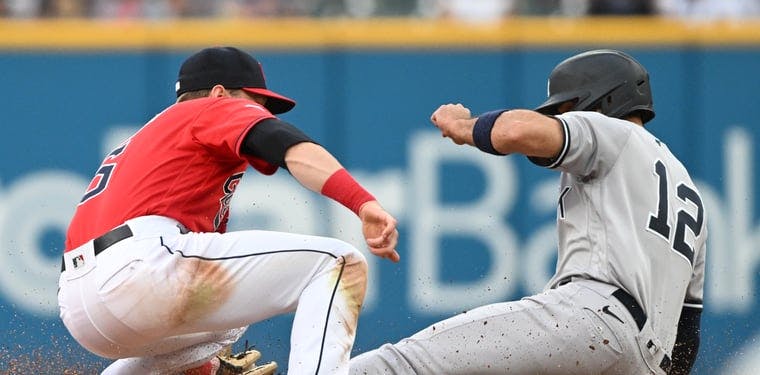 Yankees shortstop Isiah Kiner-Falefa steals second as Guardians second baseman Owen Miller is late with the tag