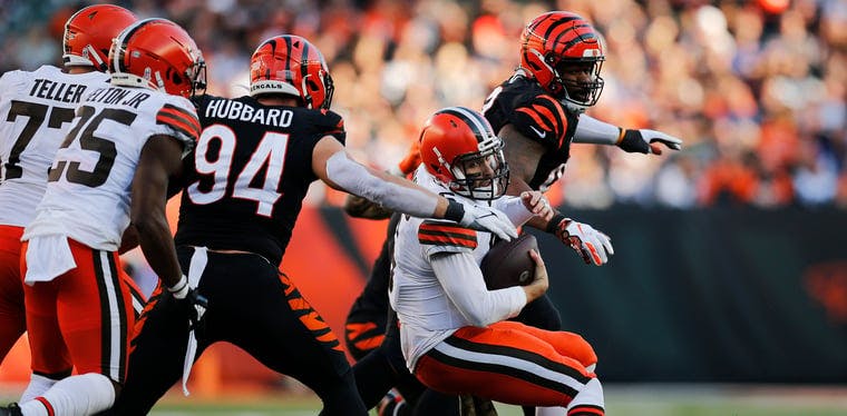  Browns quarterback Baker Mayfield is sacked by Cincinnati Bengals defensive end Sam Hubbard